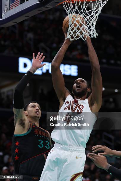 Evan Mobley of the Cleveland Cavaliers scores against the Washington Wizards at Capital One Arena on February 25, 2024 in Washington, DC. NOTE TO...