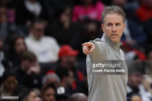 Interim Head Coach Brian Keefe of the Washington Wizards looks on against the Cleveland Cavaliers during the second half at Capital One Arena on...