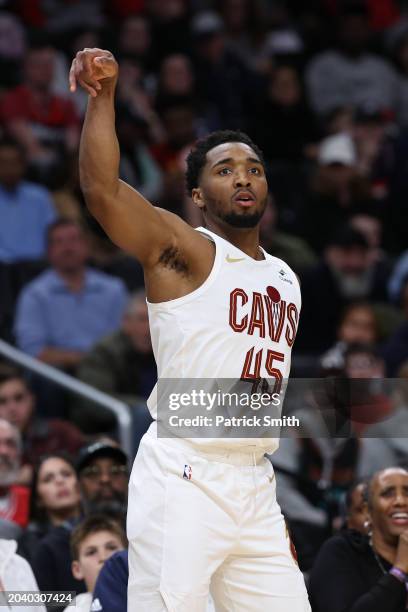 Donovan Mitchell of the Cleveland Cavaliers watches his shot against the Washington Wizards at Capital One Arena on February 25, 2024 in Washington,...