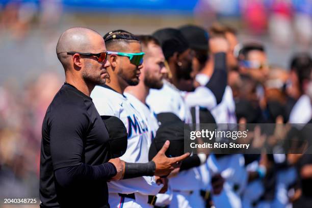 Miami Marlins manager Skip Schumaker looks on prior to a spring training game against the Washington Nationals at Roger Dean Stadium on February 25,...