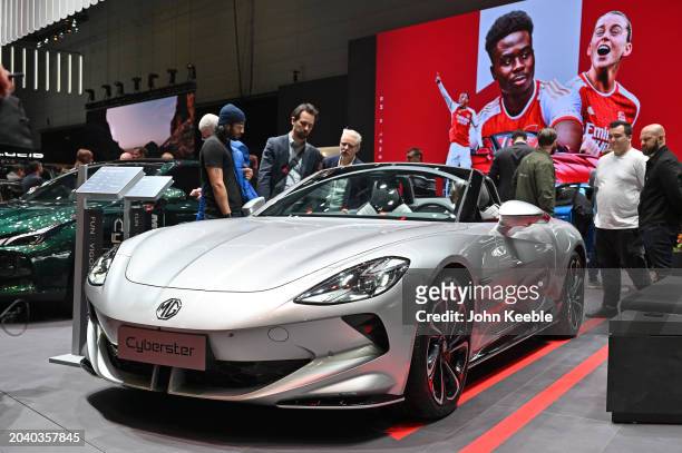 An MG Cyberster fully Electric EV car is displayed in front of a screen showing Arsenal Football Club as official automotive partner during the...
