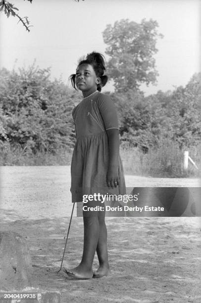 Girl barefoot in Mississippi, United States, 1960s.