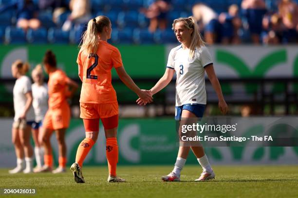 Poppy Pattinson of England shakes hands with Kim Everaerts of the Netherlands following the International Women's Friendly between Netherlands U23...