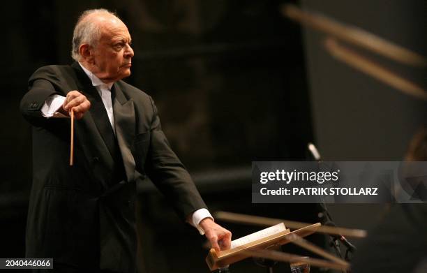 Conductor Lorin Maazel leads his orchestra, whose musicians come mainly from the Ruhr region, during the final rehearsal of "Symphony No.8 Es Dur -...