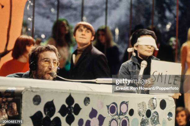 John Lennon of The Beatles and the Plastic Ono Band performing the song 'Instant Karma' on the set of a pop music television show in London on 11th...