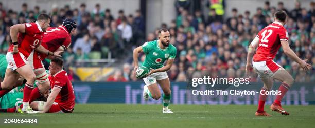 February 24: Jamison Gibson-Park of Ireland defended by Elliot Dee of Wales, Adam Beard of Wales and Nick Tompkins of Wales during the Ireland V...