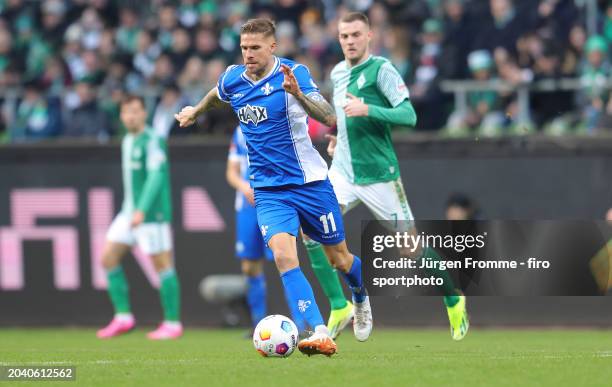 Tobias Kempe of Darmstadt plays the ball during the Bundesliga match between SV Werder Bremen and SV Darmstadt 98 at Wohninvest Weserstadion on...