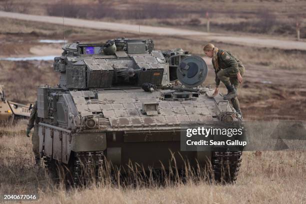 The female driver of a Spanish Armed Forces Pizarro variant of the ASCOD armoured fighting vehicle prepares to drive it in the NATO "Brilliant Jump"...