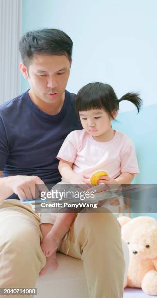 asian father accompany child study - accompanying stock pictures, royalty-free photos & images