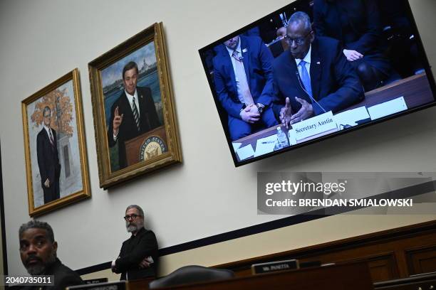 Defense Secretary Lloyd Austin is seen on a TV screen as he testifies during a House Committee on Armed Services hearing to examine the circumstances...