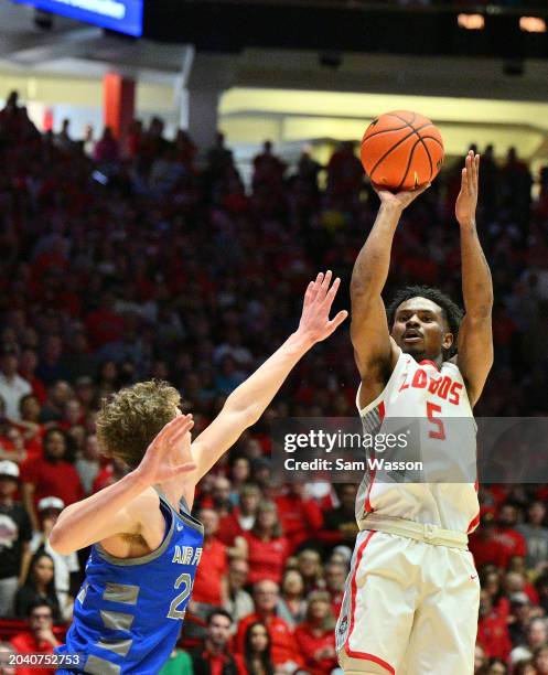 Jamal Mashburn Jr. #5 of the New Mexico Lobos shoots against Kellan Boylan of the Air Force Falcons during the second half at The Pit on February 24,...