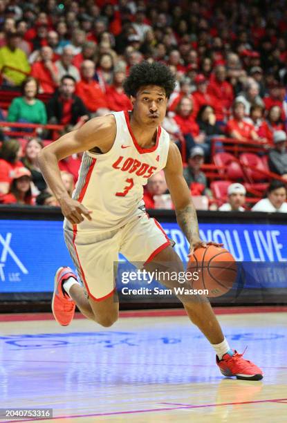 Tru Washington of the New Mexico Lobos drives to the basket against the Air Force Falcons during the second half at The Pit on February 24, 2024 in...