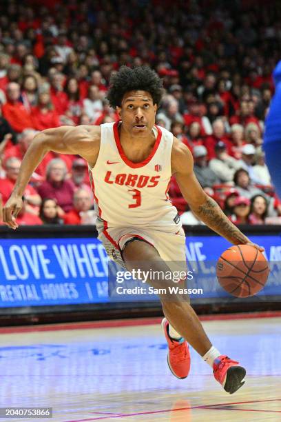 Tru Washington of the New Mexico Lobos drives to the basket against the Air Force Falcons during the second half at The Pit on February 24, 2024 in...