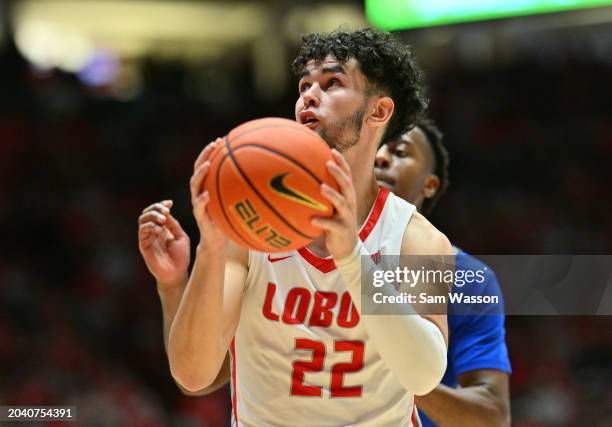 Mustapha Amzil of the New Mexico Lobos shoots against Ethan Taylor of the Air Force Falcons during the second half at The Pit on February 24, 2024 in...