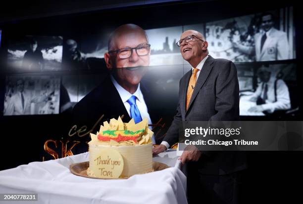 Chief meteorologist Tom Skilling stands beside his celebratory cake after his final broadcast during the 10 p.m. News on Thursday, Feb. 28 in Chicago.