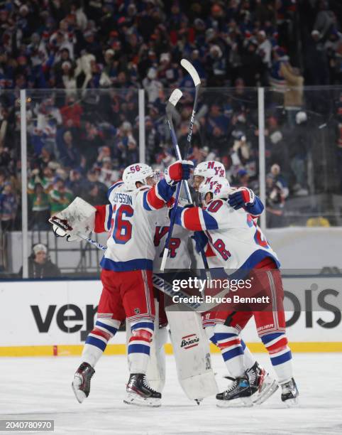 Erik Gustafsson, Igor Shesterkin, K'Andre Miller and Chris Kreider of the New York Rangers celebrate the game-winning goal against the New York...