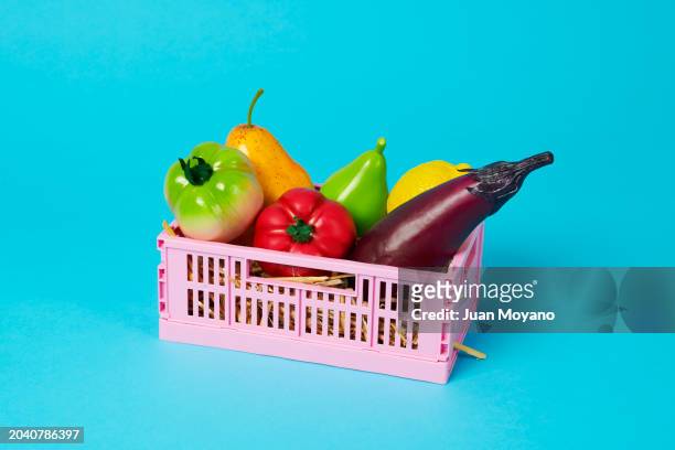 fake fruits and vegetables in a plastic crate - cassetta degli attrezzi foto e immagini stock