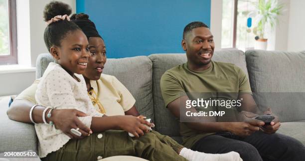 black family, video game and esports in living room with virtual competition and controller at home. happy, mother and dad with a young girl on a couch with kids gaming of mom, father and child - 4k resolution stock pictures, royalty-free photos & images