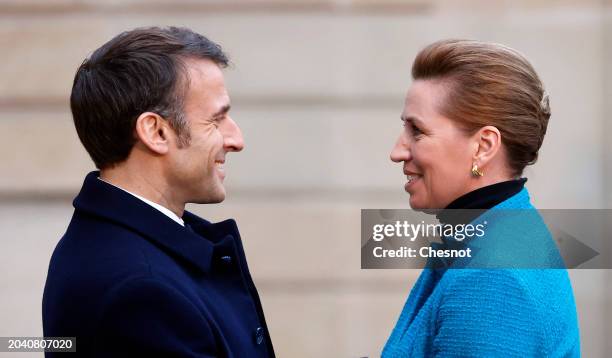 French President Emmanuel Macron welcomes Denmark's Prime Minister Mette Frederiksen as he arrives to attend a conference in support of Ukraine with...