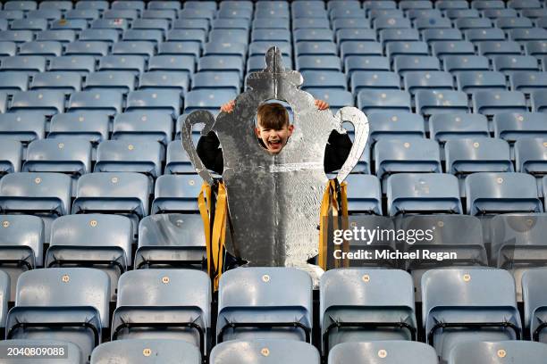 Fan of Maidstone United poses for a photo with a large Tinfoil FA Cup Trophy prior to the Emirates FA Cup Fifth Round match between Coventry City and...