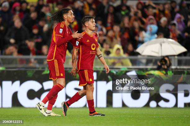 Paulo Dybala of AS Roma celebrates with Chris Smalling after scoring his team's first goal from a penalty kick during the Serie A TIM match between...