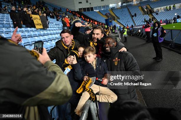 George Elokobi, Manager of Maidstone United, poses for a photo with fans prior to the Emirates FA Cup Fifth Round match between Coventry City and...