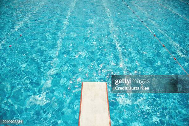 diving board over swimming pool - swimming pool stock pictures, royalty-free photos & images
