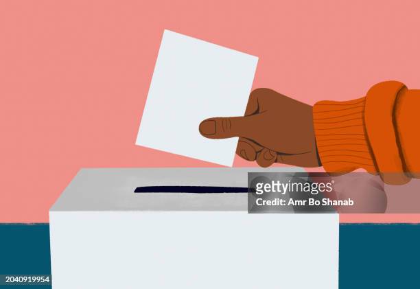 close up hand of voter placing ballot in ballot box - ballot box stock illustrations