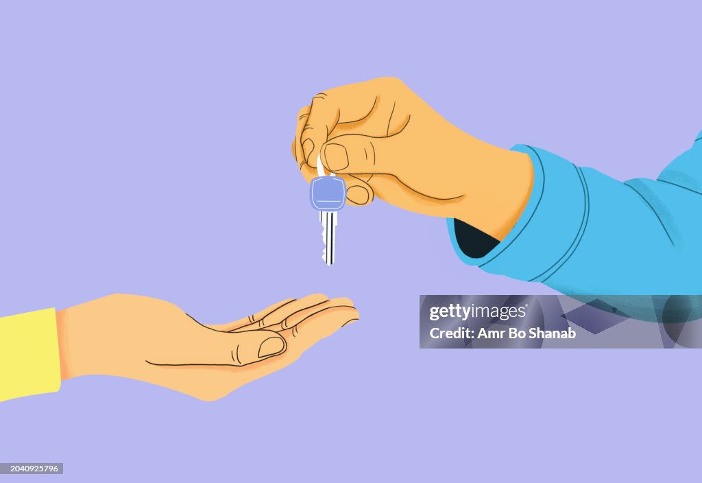 Close up real estate agent giving new house keys to client