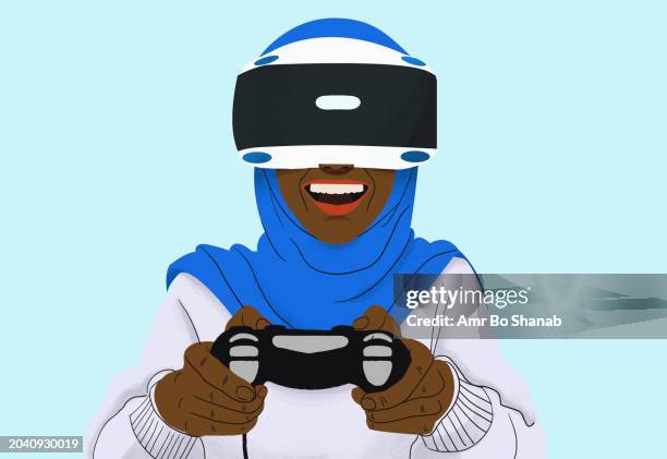 happy woman in hijab playing video game with vr headset - headscarf stock illustrations