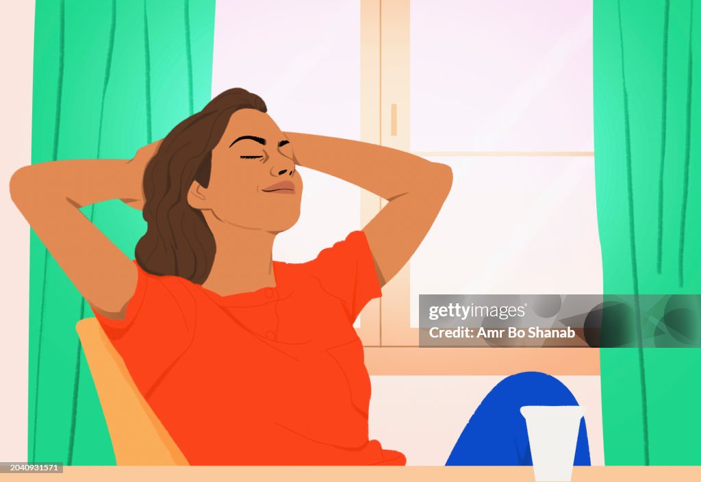 Serene woman relaxing with hands behind head at home