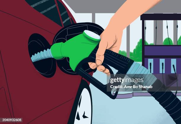 close up hand with biofuel pump filling gas tank at gas station - gasoline stock illustrations