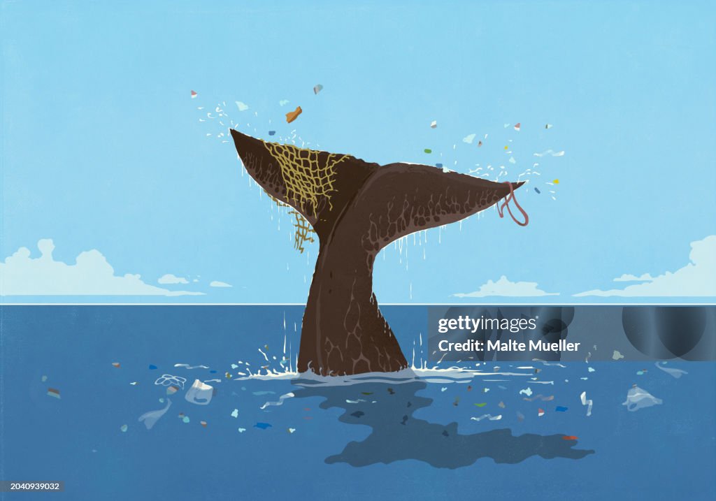 Pollution falling from whale fluke above ocean surface