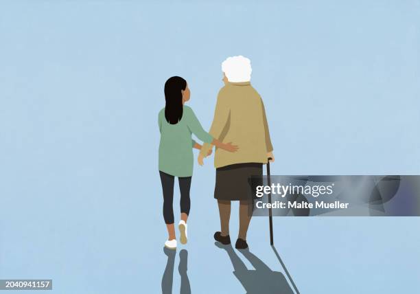 supportive granddaughter walking with senior grandmother using cane - enkel object stock-grafiken, -clipart, -cartoons und -symbole