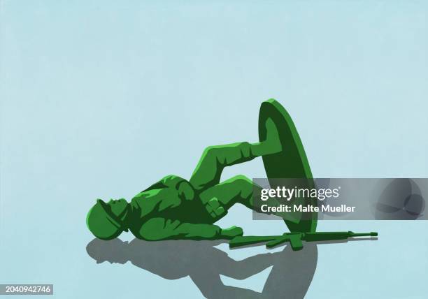 fallen toy soldier on blue background - action man stock illustrations