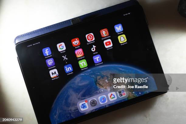 In this photo illustration, social media apps are displayed on an iPad on February 26 in Miami, Florida. The US Supreme Court is hearing a case on...