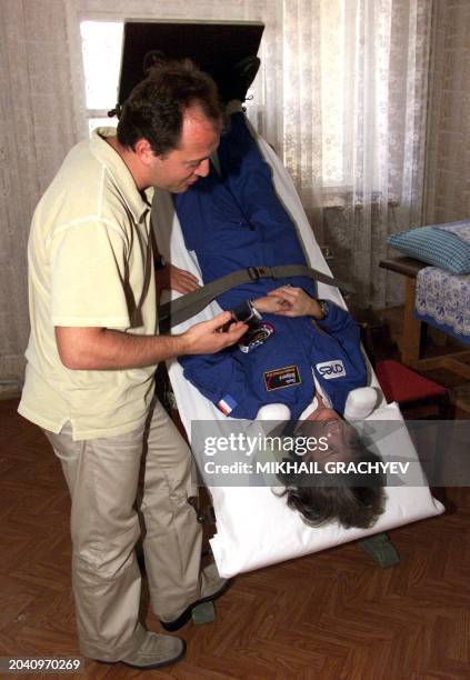 French doctor makes tests with astronaut Claudie Haignere in Baikonur cosmodrome , 19 October 2001. French astronaut Claudie Haignere and her Russian...