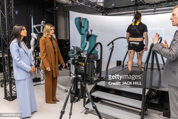British Prime Minister Rishi Sunak's wife, Akshata Murty and Ukraine's First Lady Olena Zelenska react as they are shown a laboratory where an...