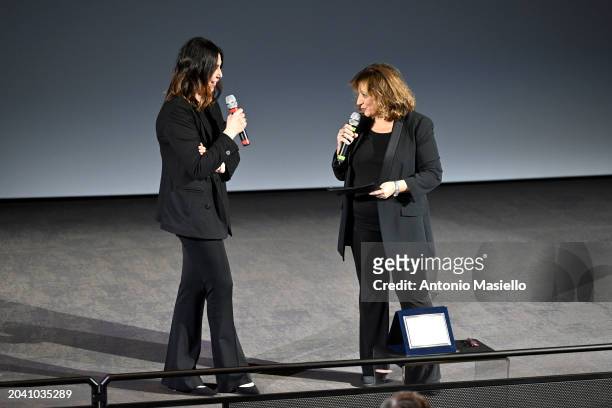 Eleonora Pratelli receives an award from Laura Delli Colli during the ceremony of the Nastri D'Argento Documentary Prize 2024 at Cinema Barberini on...