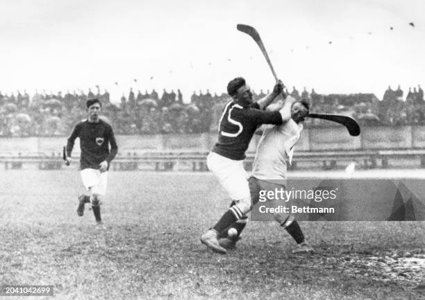 An Irish forward, in the white uniform, is shown scoring at the Paris 1924 Olympics.