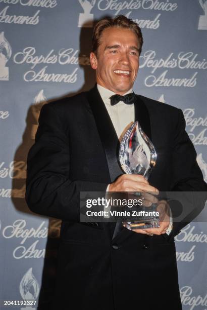 Actor Arnold Schwarzenegger with his award at the 1992 People's Choice Awards, at Universal Studios in Universal City, California, US, 17th March...