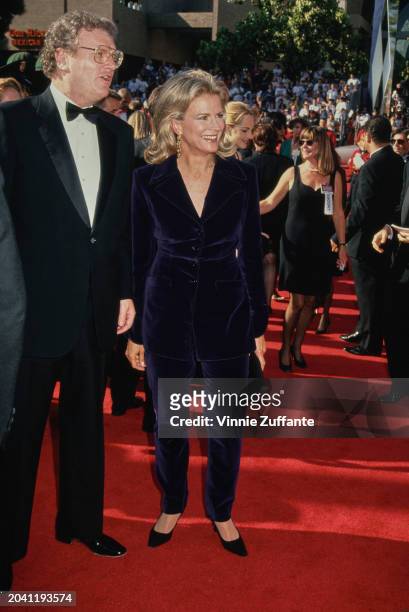 Television Executive Howard Stringer and American actress Candice Bergen, wearing a blue velvet trouser suit, on the red carpet at the 46th Primetime...