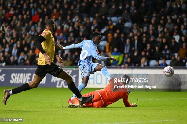 Fabio Tavares of Coventry City scores his team's fourth goal past Lucas Covolan of Maidstone United during the Emirates FA Cup Fifth Round match...