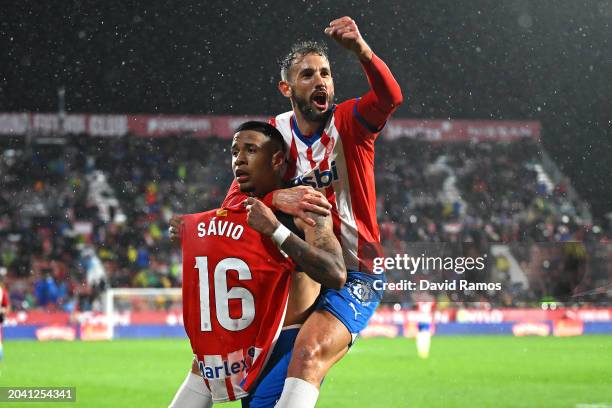 Savio of Girona celebrates scoring the 2nd team goal with team mate Cristhian Stuani during the LaLiga EA Sports match between Girona FC and Rayo...