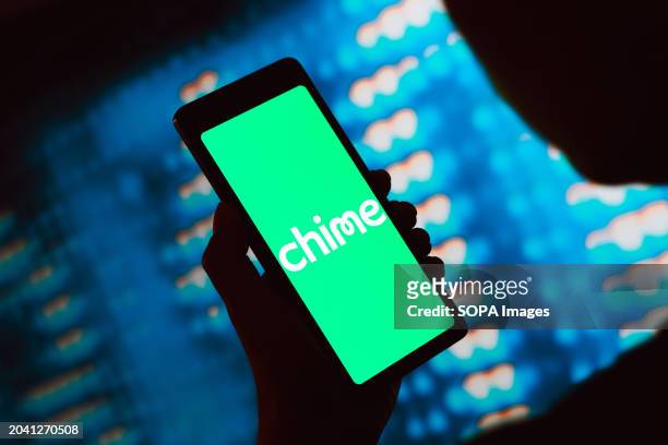 In this photo illustration, the Chime Financial, Inc. Logo is displayed on a smartphone screen.