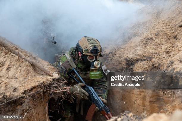 Servicemen of the National Guard of Ukraine undergo training to storm enemy trenches using simulation equipment as the war between Russia and Ukraine...
