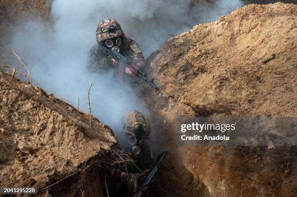 Servicemen of the National Guard of Ukraine undergo training to storm enemy trenches using simulation equipment as the war between Russia and Ukraine...