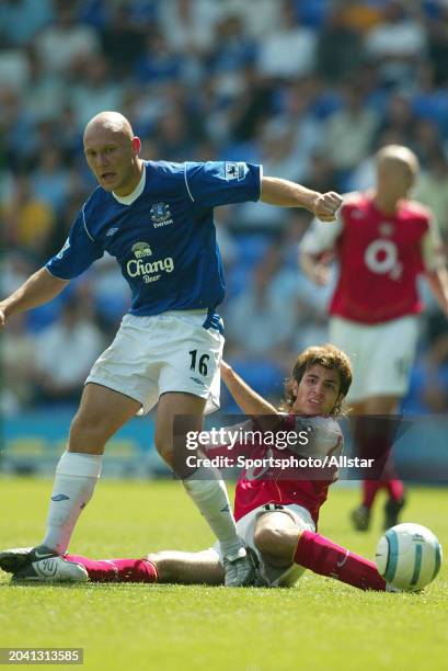 Thomas Gravesen of Everton and Cesc Fabregas of Arsenal challenge during the Premier League match between Everton and Arsenal at Goodison Park on...