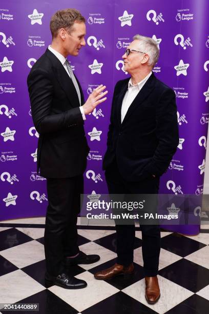 Dan Walker and Gary Lineker talking at the Ultimate News Quiz charity fundraiser at the Grand Connaught Rooms in London. Celebrities will battle it...