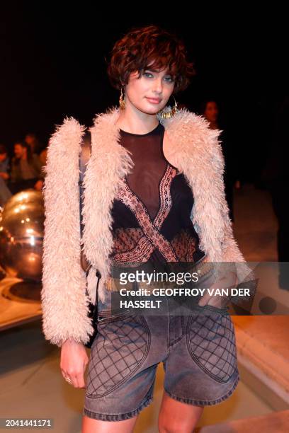 Model Taylor Hill poses ahead of the presentation of creations by Isabel Marant for the Women Ready-to-wear Fall-Winter 2024/2025 collection as part...
